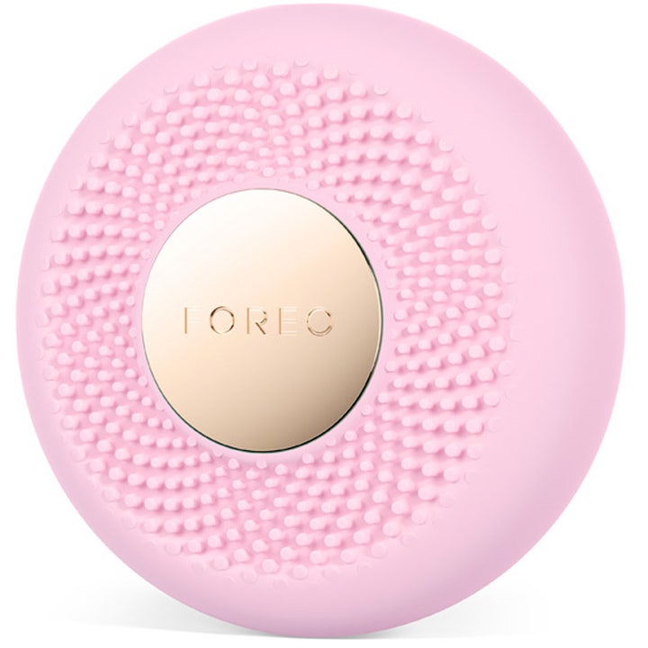FOREO UFO 3 mini Pearl Pink 1 stk hudpleieverktøy i lyserosa teksturert silikon med en rund gullfarget plate