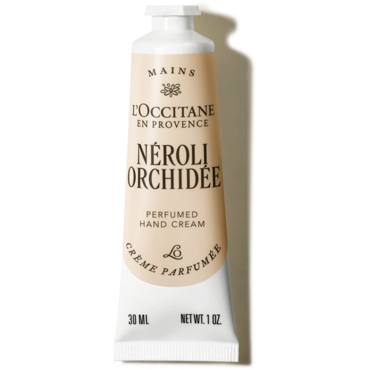 L'Occitane Néroli & Orchidée 30 ml pleiende håndkrem i en hvit og beige tube med elegant hvitt skrulokk