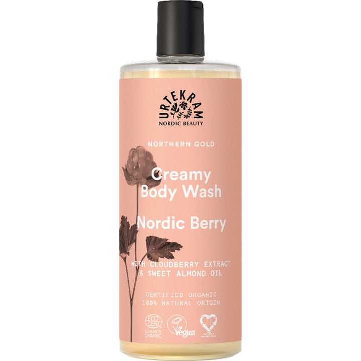 Urtekram Nordic Berry Creamy Body Wash pleiende dusjsåpe i klar flaske med ferskenfarget etikett og sort kork