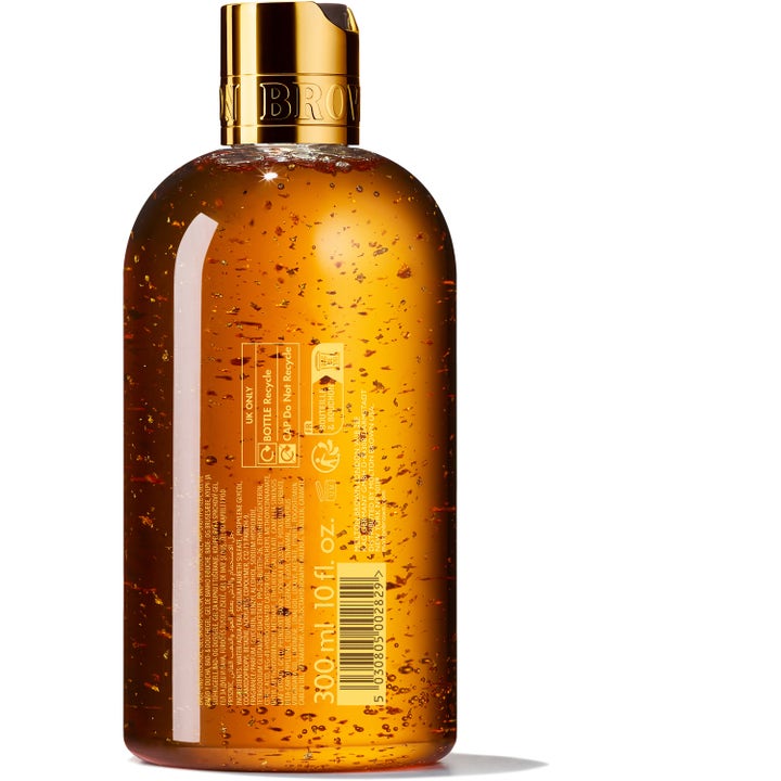 Molton Brown Mesmerising Oudh Accord & Gold 300 ml dusjsåpe med synlige gullflak i ravfarget gelé og gullkork