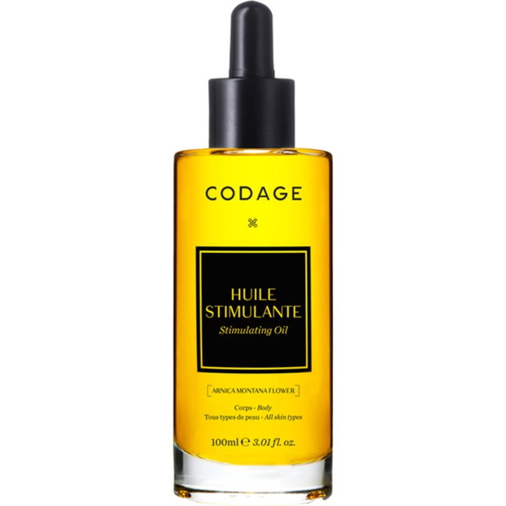 Codage Huile Stimulante 100 ml stimulerende kroppsolje i glassflaske med gyllengul olje og svart etikett med pipette.