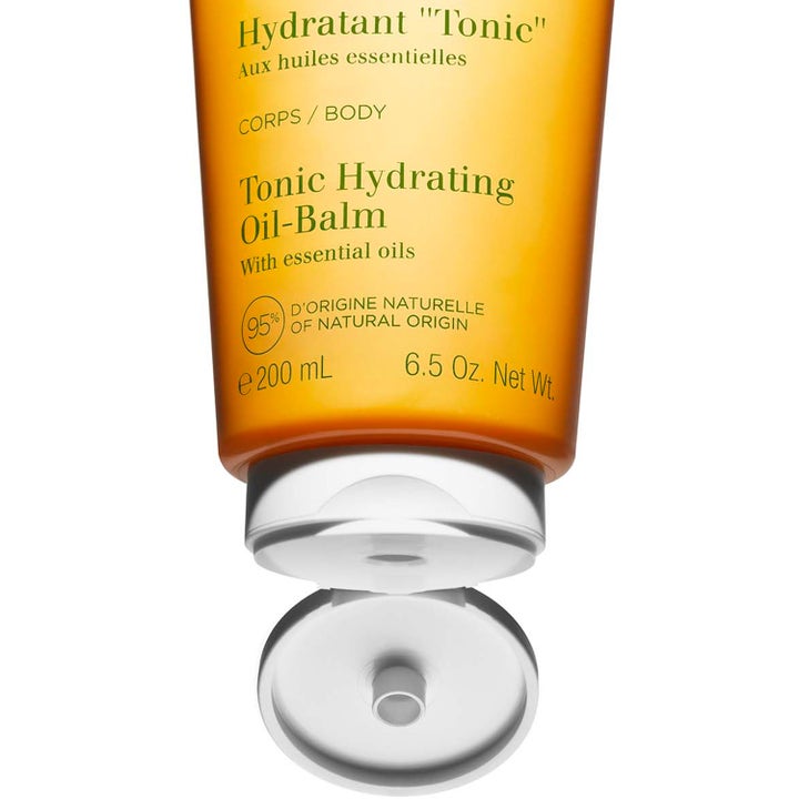 Clarins Hydrating Toning Body Balm 200 ml pleiende body lotion i oransje tube med åpen hvit kork