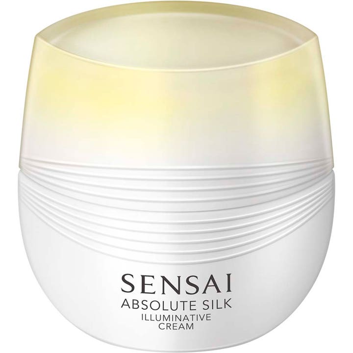 Sensai Absolute Silk Illuminative Cream glødgivende ansiktskrem i hvit krukke med rillet tekstur og gyllent lokk