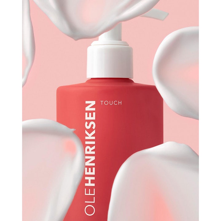 Ole Henriksen Touch Nourishing Body Lotion 400 ml fuktighetskrem i rød pumpeflaske med fyldige hvite kremsveip