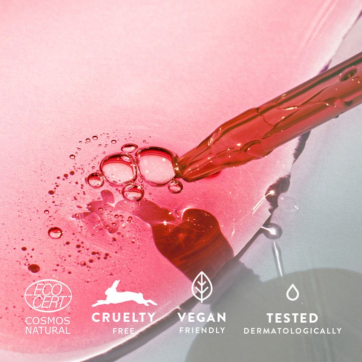 MÁDARA Peel Hyaluron Intense Peel Serum 30 ml eksfolierende serum med rosa flytende tekstur pipette og veganske symboler