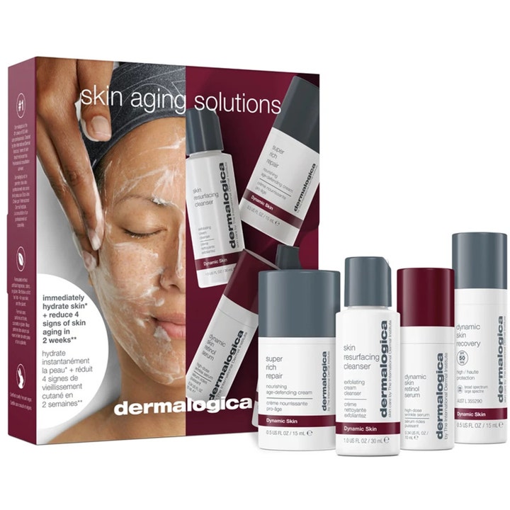 Dermalogica Skin Aging Solutions sett med 4 produkter mot aldringstegn i hvite og grå tuber foran lilla eske.