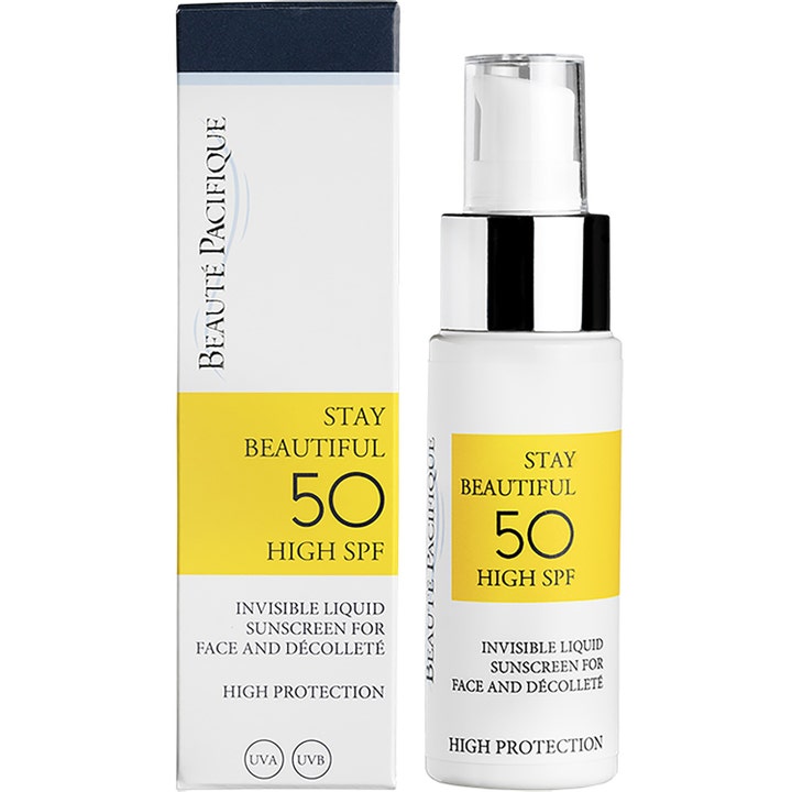 Beauté Pacifique Stay Beautiful 50 ml invisible liquid solkrem med SPF 50 i hvit flaske med sølvpumpe og gul eske