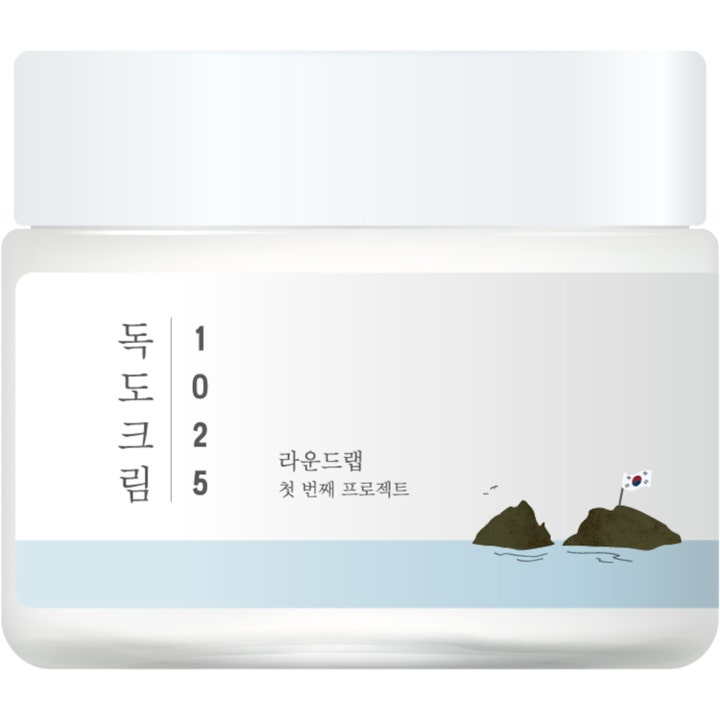 Round Lab 1025 Dokdo Cream 80ml fuktighetsgivende ansiktskrem i hvit krukke med bilde av øyer og hav.