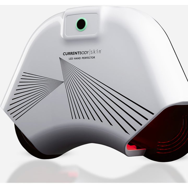 Currentbody Skin LED Hand Perfector antialdrende håndmaske i hvit plast med rødt LED-lys