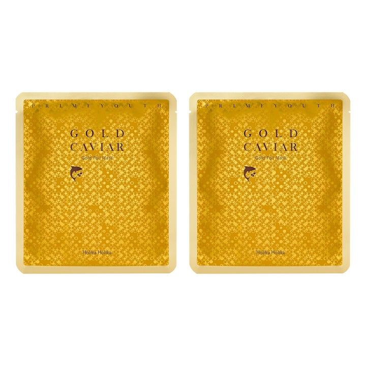 Holika Holika Prime Youth Gold Caviar Gold Foil Mask ansiktsmaske gir glød i gullfarget foliepakning med sirkelmønster