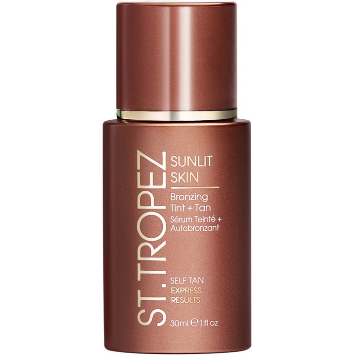 St. Tropez Sunlit Skin 30 ml selvbruning serum som gir glød i en metallisk brun flaske