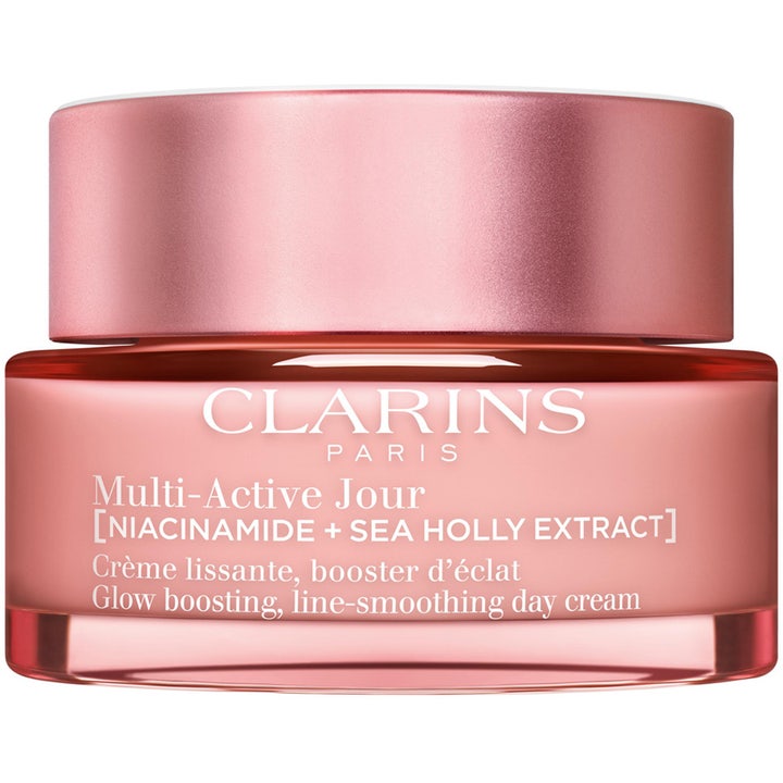 Clarins Multi-Active Jour glødgivende dagkrem med niacinamid i en rosa glasskrukke som glatter ut fine linjer.
