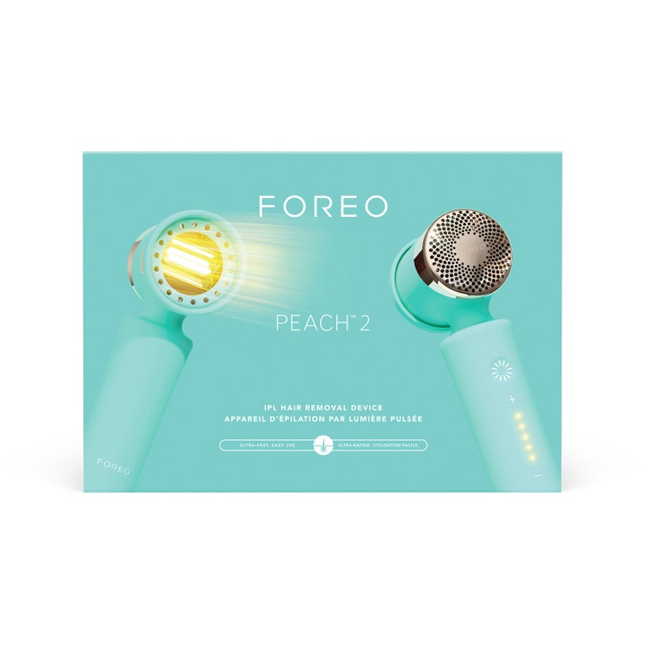FOREO PEACH 2 Mint 1 stk IPL hårfjerning i mintgrønn eske som viser enheten med gult lysglimt