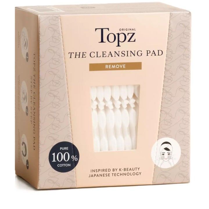 Topz Original The Cleansing Pad rensepads fjerner sminke i en beige eske med vindu som viser hvite bomullspads