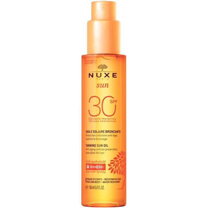 Nuxe Sun Tanning Sun Oil SPF 30 150 ml sololje gir beskyttelse i en gjennomsiktig oransje sprayflaske