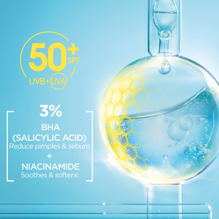 Garnier Pureactive UV Daily Fluid 40 ml solkrem med SPF 50 og BHA i en blå laboratoriekolbe som reduserer talg