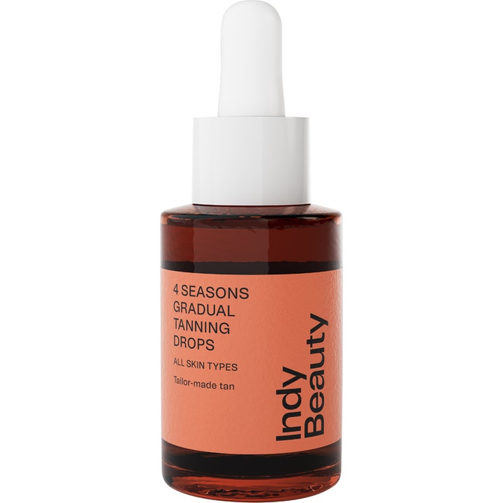 Indy Beauty 4 Seasons Gradual Tanning Drops gir gradvis glød i en brun glassflaske med ferskenfarget etikett.
