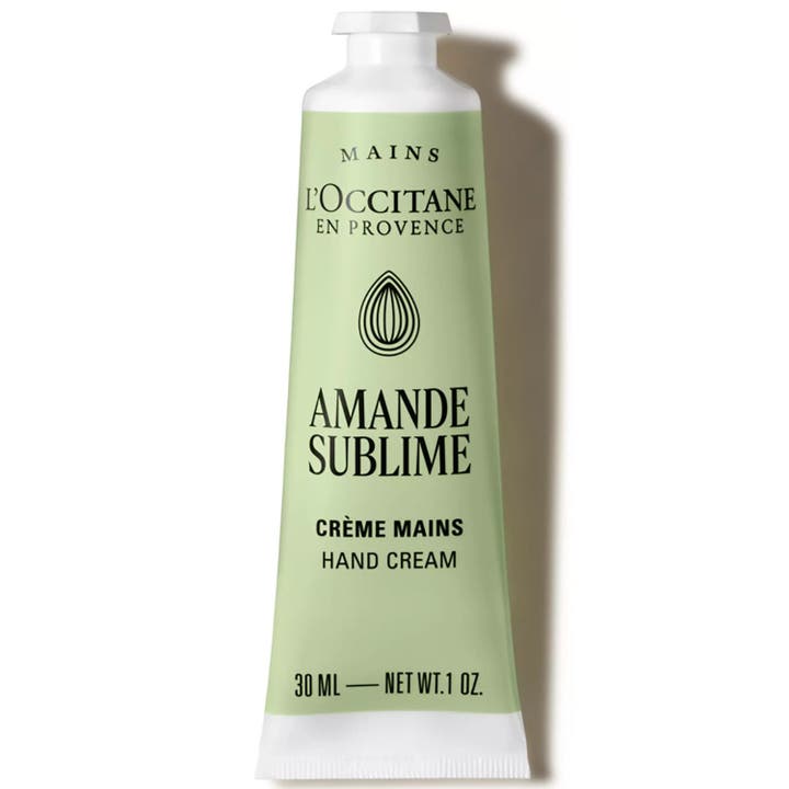 L'Occitane Amande Delicious Hands 30 ml pleiende håndkrem i lysegrønn tube med sølvdetaljer og svart kork