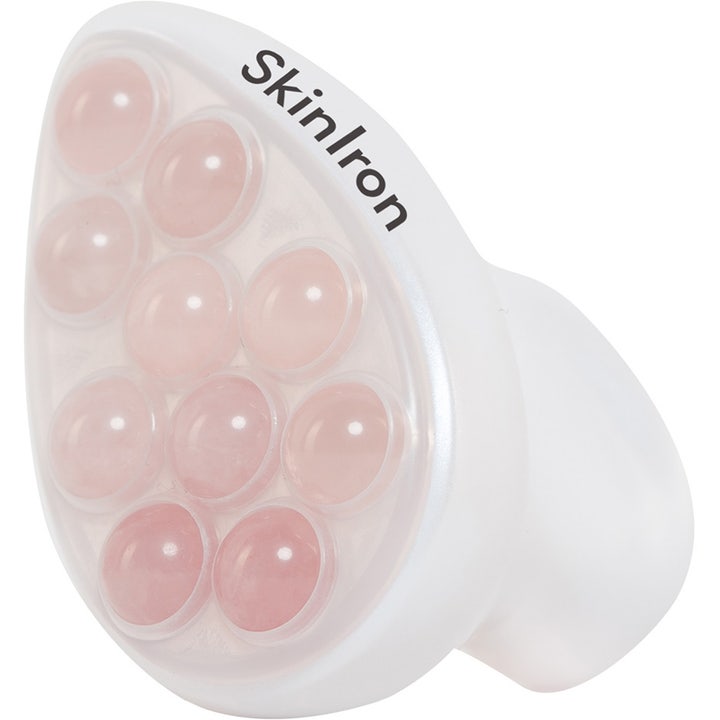 SkinIron ansiktsmassasje 1 stk som strammer opp hvit ergonomisk enhet med små runde rosa massasjekuler