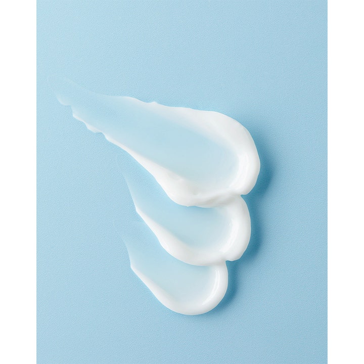 NIVEA Repair & Care Hand Cream 100 ml fuktighetsgivende håndkrem med fyldig hvit tekstur på blå bakgrunn
