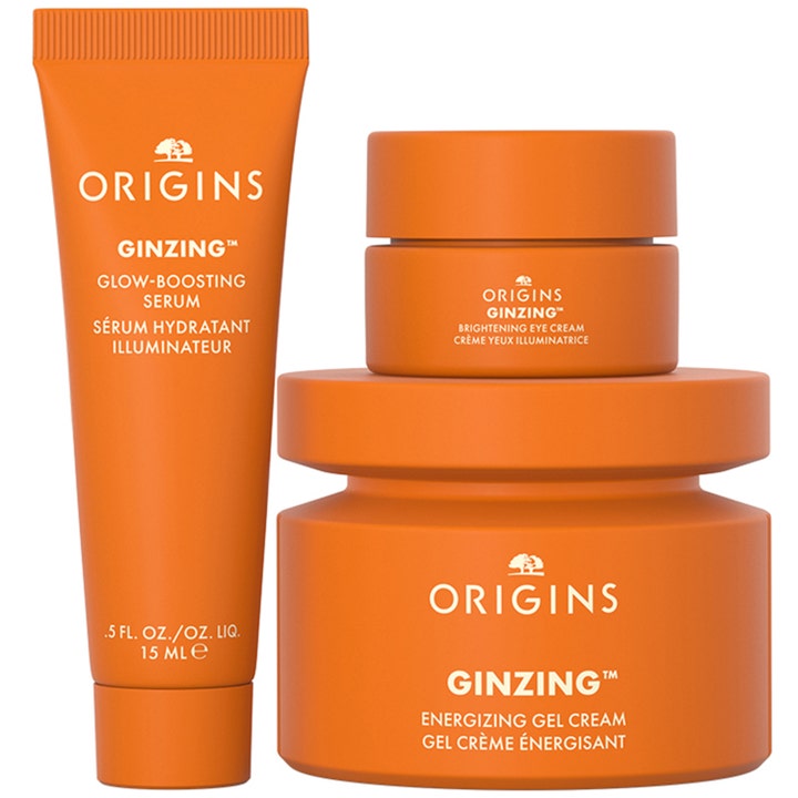 Origins The Glow-Boosting Collection 70 ml hudpleiesett med oransje GinZing serum og kremer som gir glød.