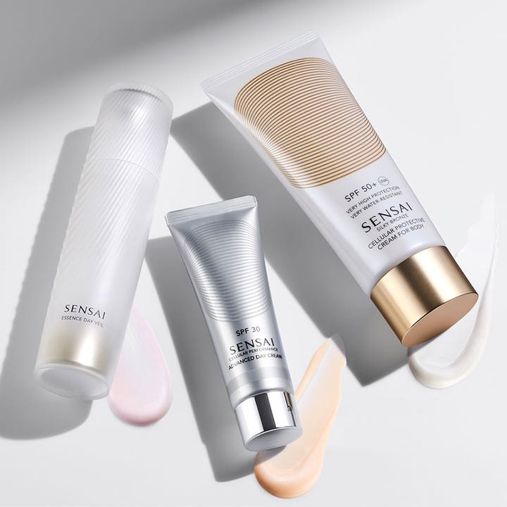 Sensai Cellular Performance Advanced Day Cream 50 ml solkrem SPF 30 i sølvfarget tube med ferskenfarget krem