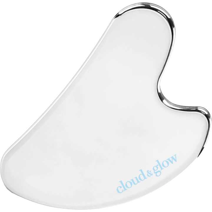 Cloud & Glow Gua Sha massasjeverktøy som gir glød hjerteformet hvit stein med elegant sølvfarget kant.