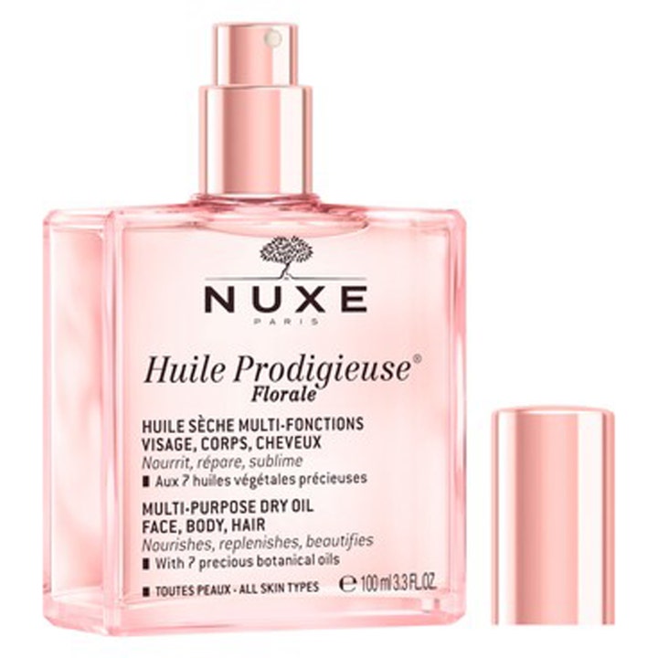 Nuxe Huile Prodigieuse Florale 100 ml nærende tørrolje i rosa glassflaske med spraypumpe og løs metallisk kork