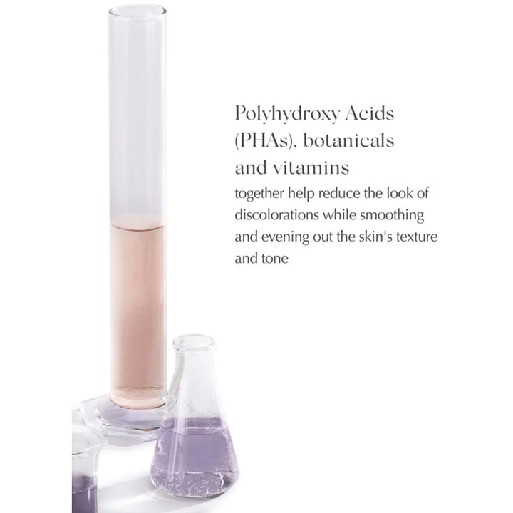 Exuviance Daily Eye Smoother 15 g utjevnende øyekrem med PHAs vist med rosa og lilla laboratorieglass.