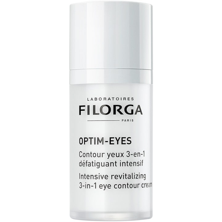 Filorga Optim-Eyes 15 ml revitaliserende øyekrem som motvirker mørke ringer i en hvit sylindrisk pumpeflaske.