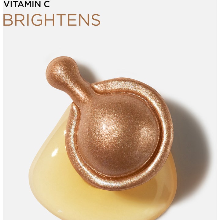 Elizabeth Arden Ceramide Capsules Vitamin C 30 stk serum med bronsekapsel på gul dråpe og tekst Vitamin C Brightens
