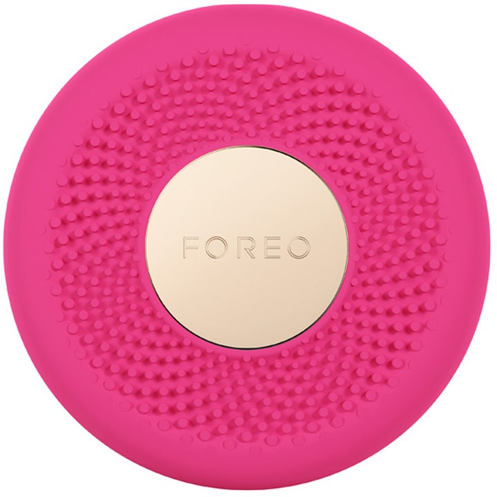 Foreo UFO 2 1 stk smart ansiktsbehandling som gir glød fuchsia rosa silikonenhet med gullfarget plate.