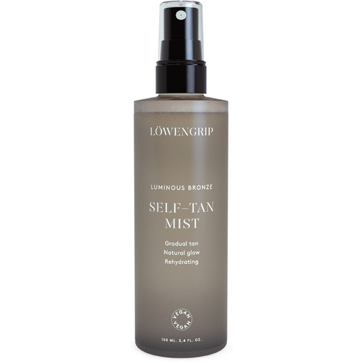 Löwengrip Luminous Bronze Self-Tan Mist 100 ml selvbruningsspray gir naturlig glød i frostet grå flaske med sort pumpe.