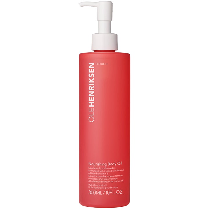 Olehenriksen Touch Nourishing Body Oil 300 ml kroppsolje som gir fuktighet i matt korallrød flaske med hvit pumpe