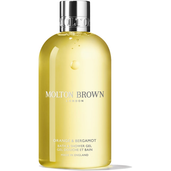 Molton Brown Orange & Bergamot 300ml oppfriskende dusjsåpe med gul gelé i gjennomsiktig flaske og sølvfarget kork