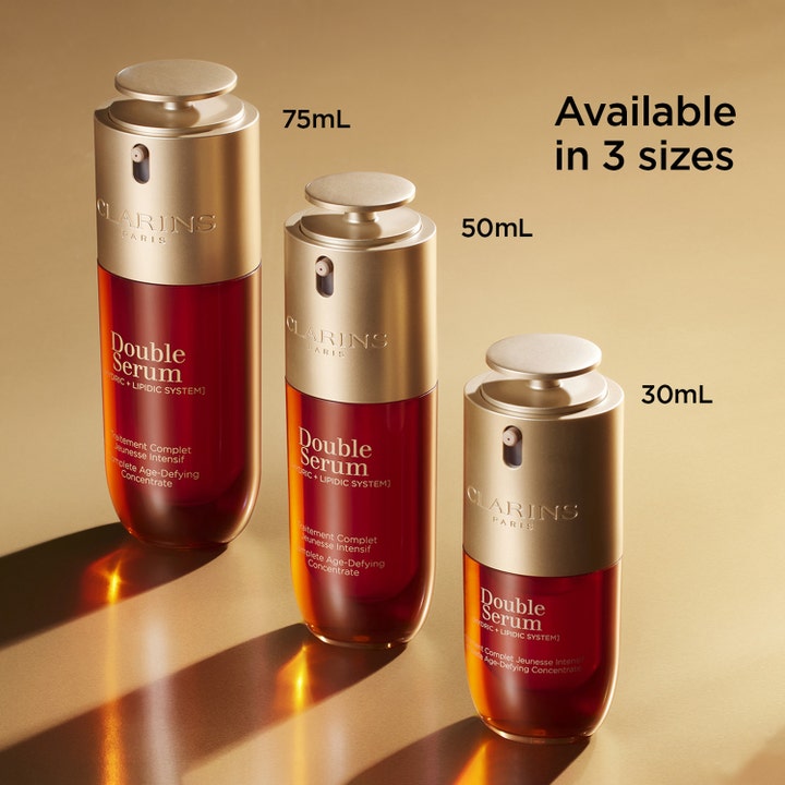 Clarins Double Serum 50 ml anti-age serum i tre størrelser med pumpehode i gull og ravfarget glass.