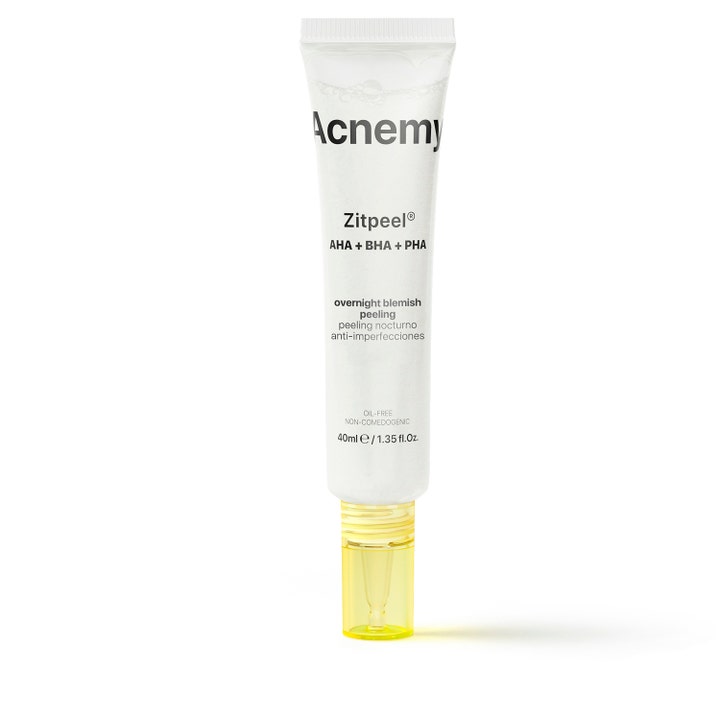 Acnemy Zitpeel 40 ml eksfolierende nattpeeling mot urenheter i en hvit tube med gul gjennomsiktig applikator