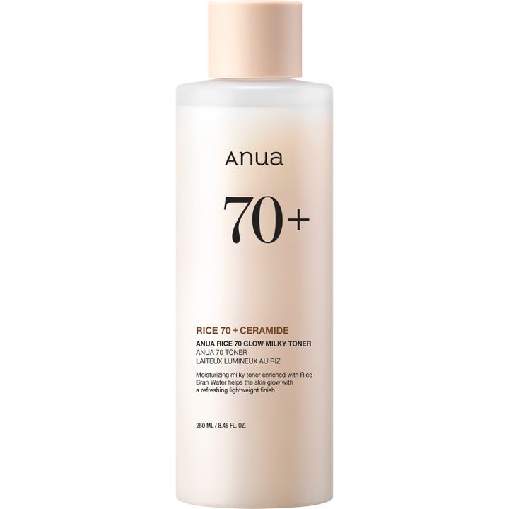 Anua Rice 70 Glow Milky Toner 250 ml fuktighetsgivende ansiktstoner i frostet flaske med ferskenfarget kork