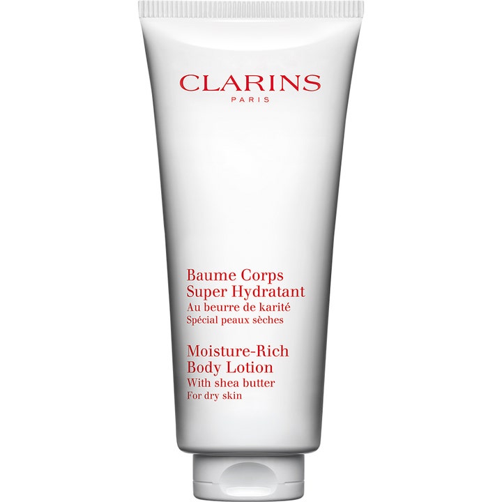 Clarins Moisture-Rich Body Lotion fuktighetsgivende kroppskrem med sheasmør for tørr hud i hvit tube med rød tekst