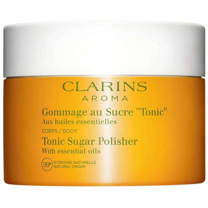Clarins Aroma Tonic Sugar Polisher 250 g eksfolierende kroppsskrubb i gul glasskrukke med hvitt lokk