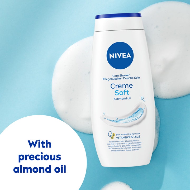 NIVEA Creme Soft Shower 250 ml pleiende dusjsåpe med mandelolje på hvit skum og blå bakgrunn