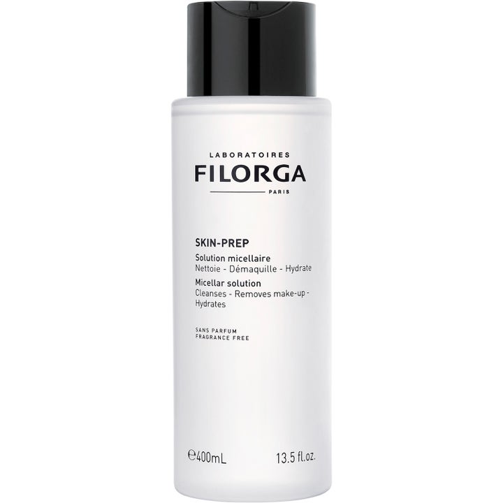 Filorga Skin-Prep Micellar Solution 400 ml rensende ansiktsvann i hvit sylindrisk flaske med sort skrulokk.