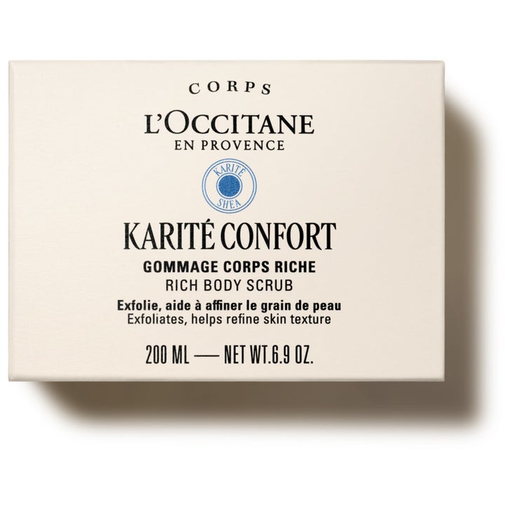 L'Occitane en Provence Shea Butter Rich Body Scrub 200 ml eksfolierende kroppsskrubb i kremhvit boks som forfiner huden