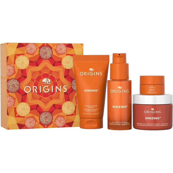 Origins GinZing hudpleiesett med rens serum og ansiktskrem i oransje emballasje som gir glød