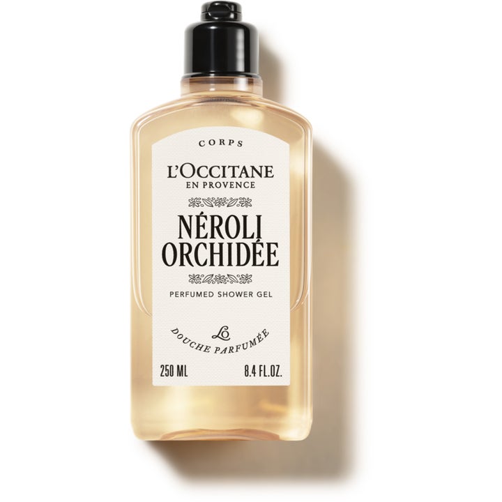 L'Occitane Néroli & Orchidée 250 ml velduftende dusjgelé i gjennomsiktig flaske med ferskenfarget innhold og sort kork.