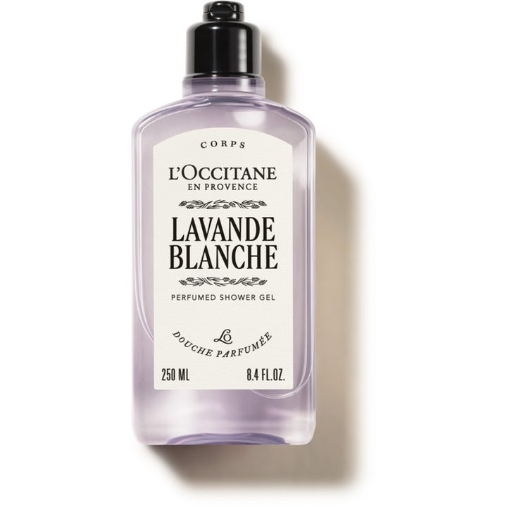 L'Occitane Lavande Blanche 250 ml beroligende dusjgelé i en klar flaske med lys lilla væske og sort kork