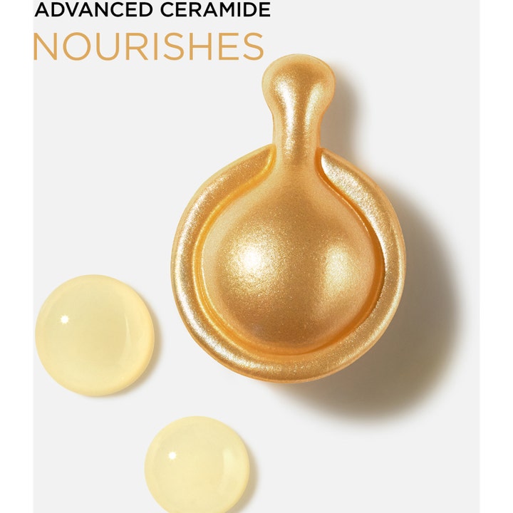 Elizabeth Arden Advanced Ceramide 30 Capsules nærende serum i gullkapsel med flytende dråper ved siden av