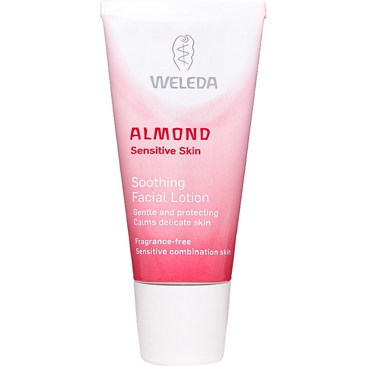 Weleda Almond Soothing Facial Lotion beroligende ansiktskrem for sensitiv hud i en hvit og rosa tube med hvit kork