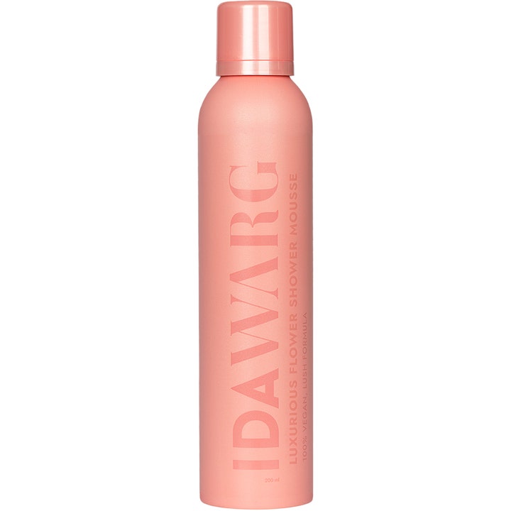 Ida Warg Luxurious Flower Shower Mousse 200 ml vegansk dusjskum i ferskenfarget sprayflaske med vertikal logo.