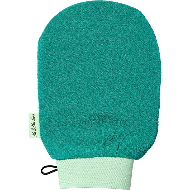 Mr & Mrs Tannie Exfoliating Mitt 1 stk eksfolierende skrubbehanske i turkis tekstur med lys grønn elastisk kant.